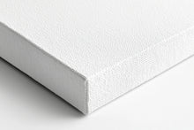 Laad de afbeelding in galerijviewer, a close up of a white mattress on a white surface
