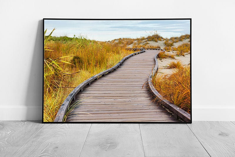 Wooden Walkway Leading Through Golden Grassy Beach Sand Dunes To A Seascape Wall Art Print on Paper Framed Picture print