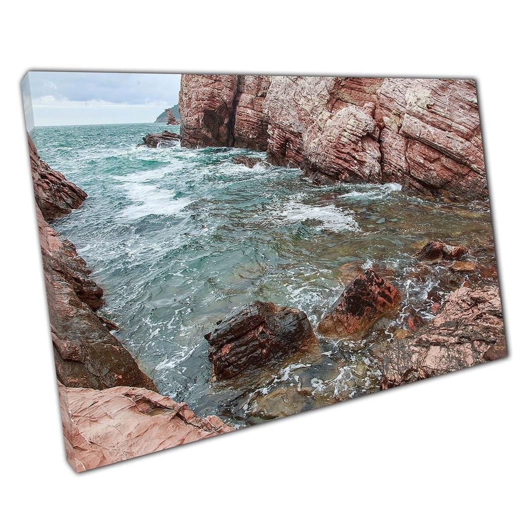 Rocky Turquoise Seascape Narrow Shore Lined With Red Toned Weathered Rock Faces Wall Art Print On Canvas Mounted Canvas print